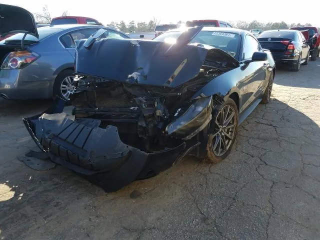 Photo from the carVertical US sample report: Ford Mustang with a destroyed front end on a salvage auction lot
